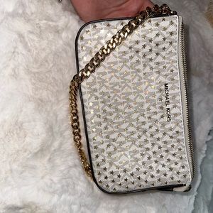 small white and gold Michael Kors hand bag